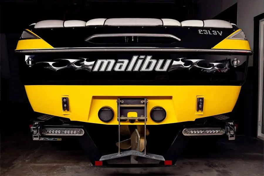 Glossy black and yellow Malibu wakeboard boat, finished hull, Colorado Springs