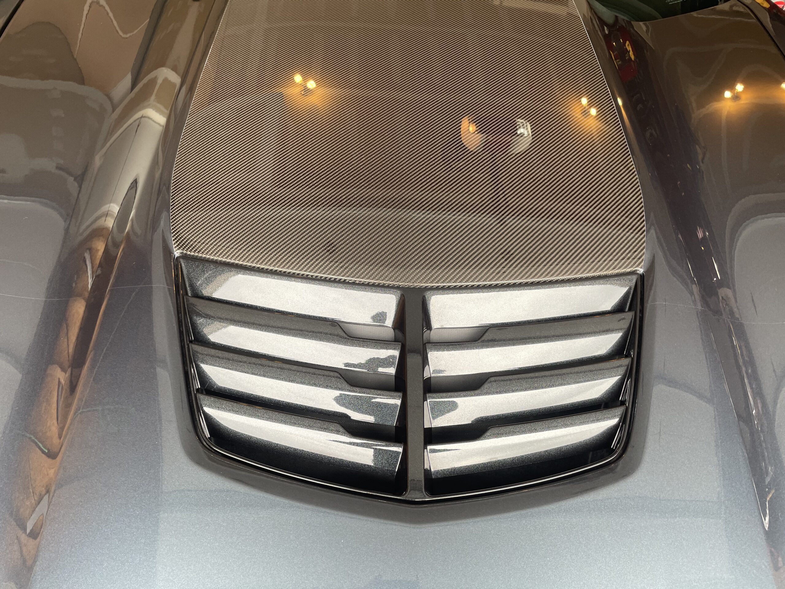 Deep gloss carbon fiber panel after paint correction and protection, Colorado Springs