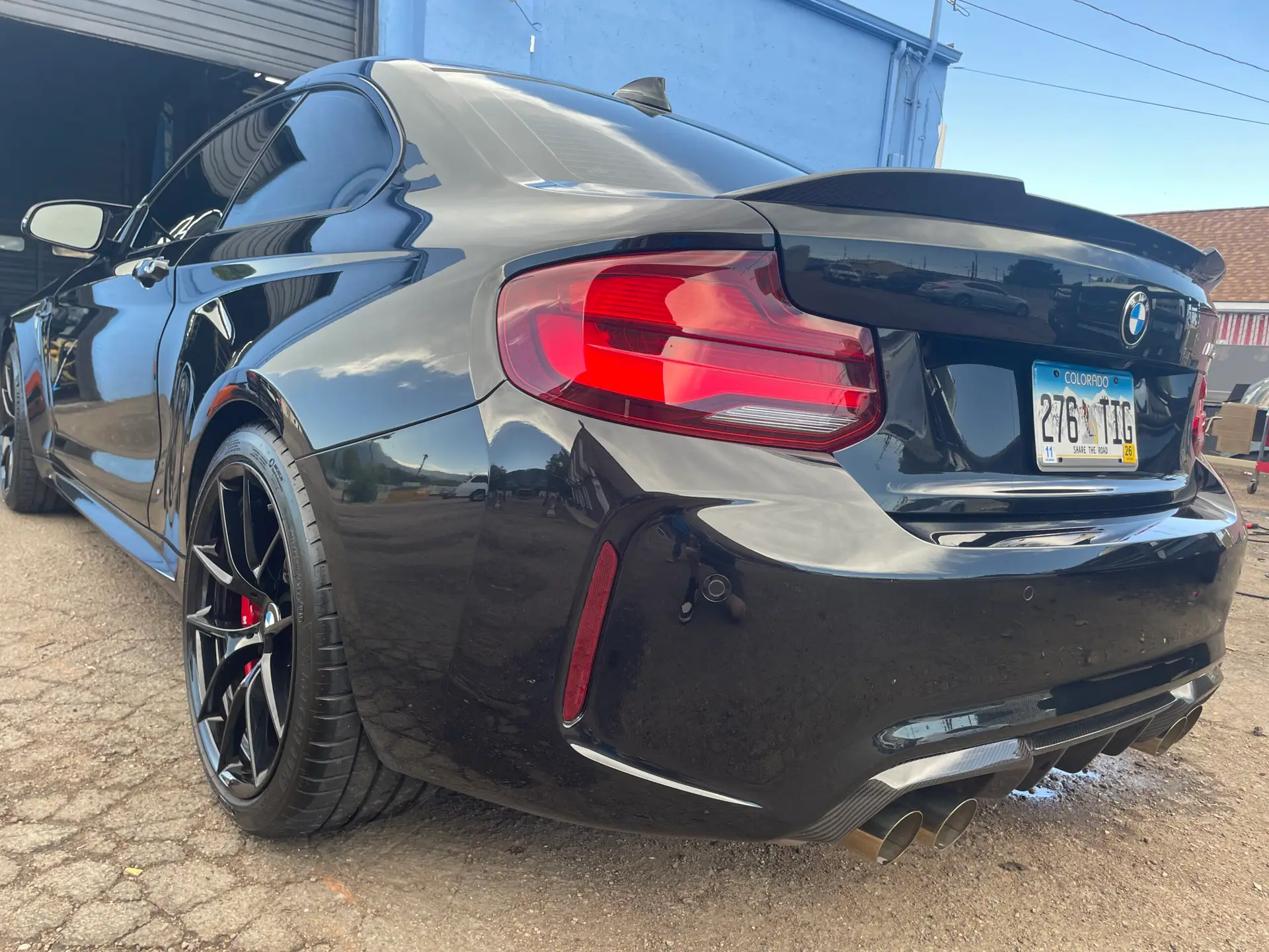 Deep gloss reflection on corrected paint under final inspection light, Colorado Springs