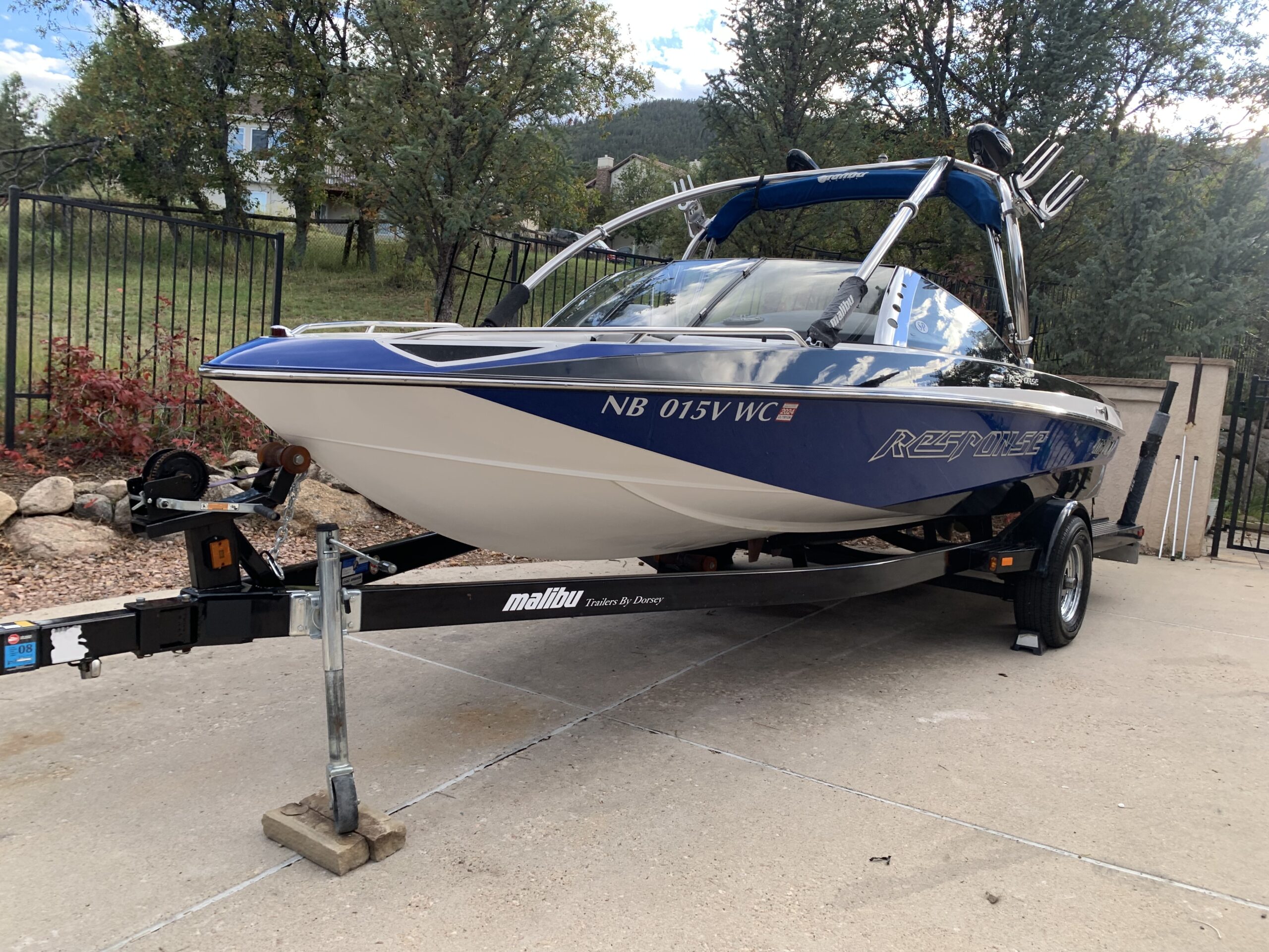 Finished ceramic-coated wakeboard boat on trailer, glossy gel coat, Colorado Springs